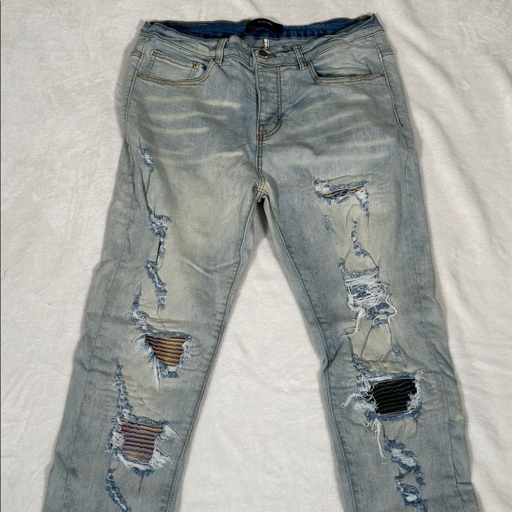 AMIRI Distressed Light Blue Jeans with Colorful Patches!